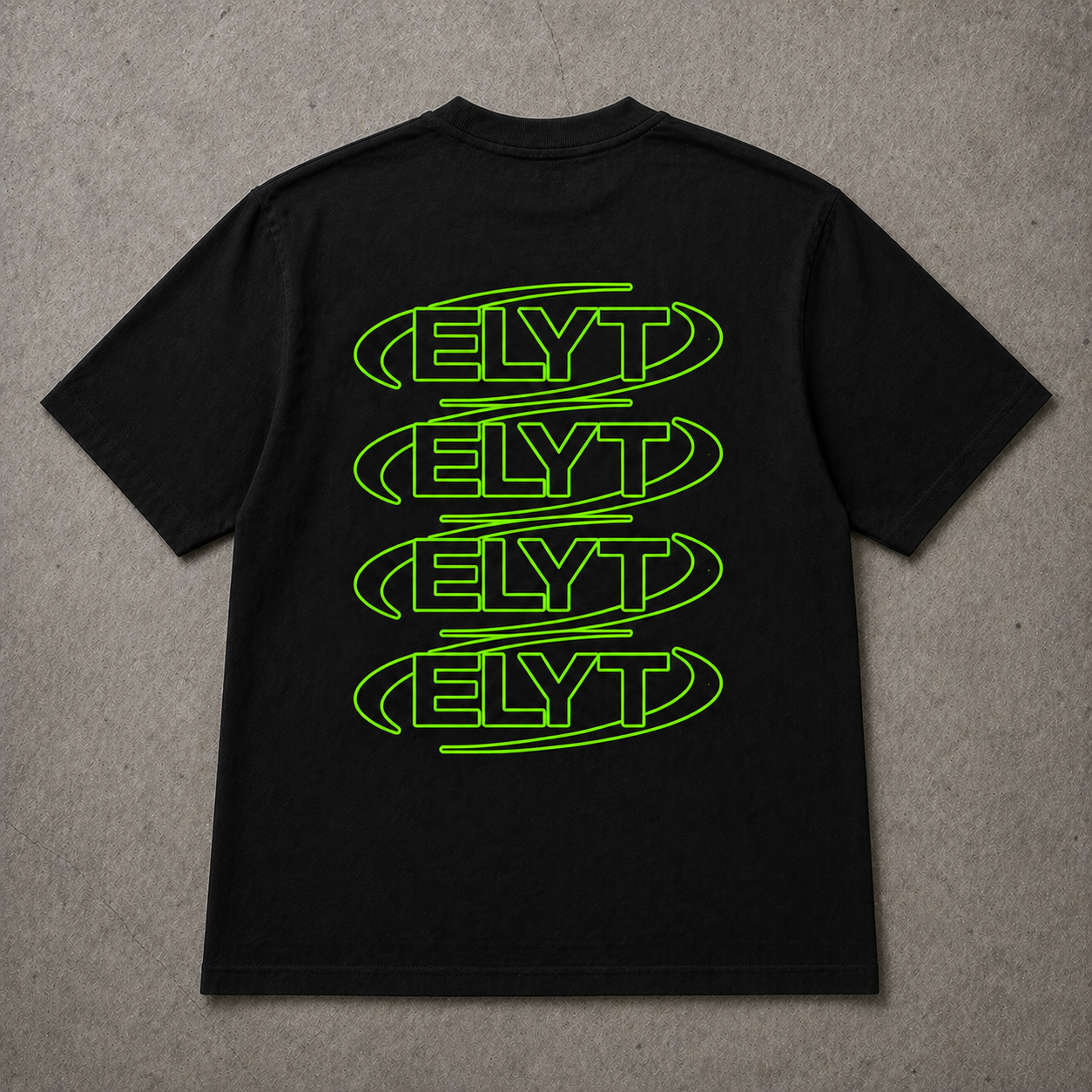 Black t-shirt with green 'ELYT' logo on a gray surface